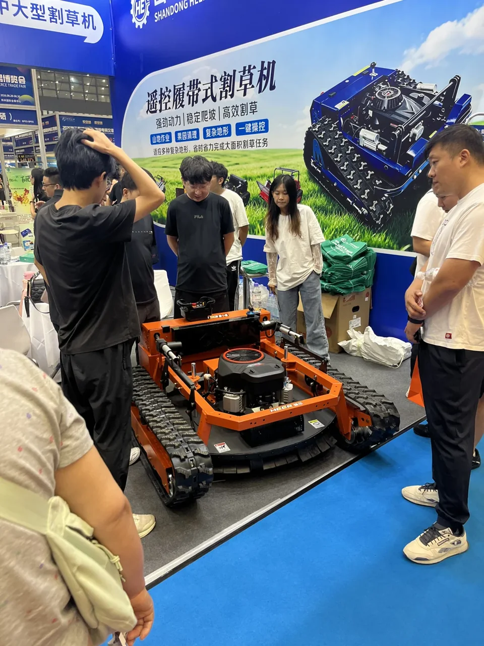 Visitors seeing HTL machinery at an exhibition